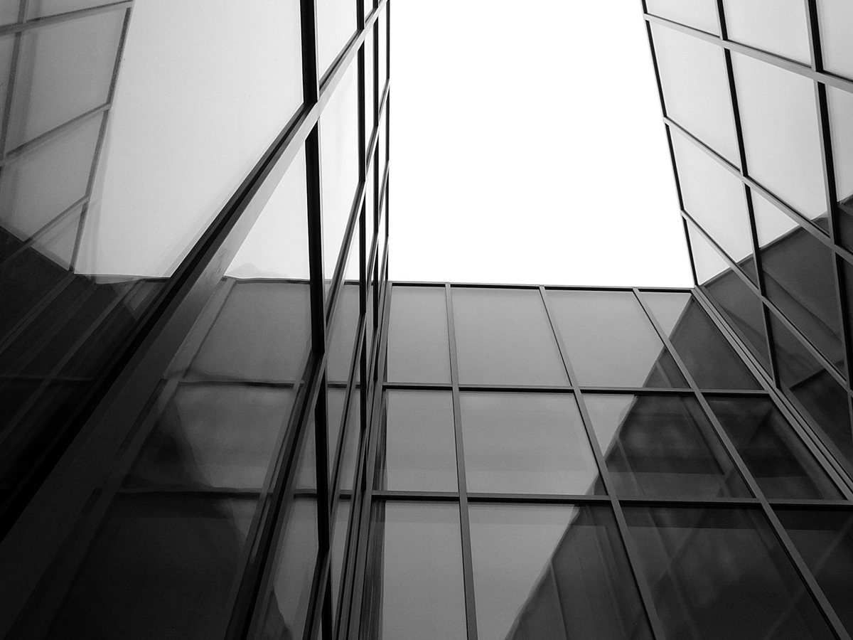 Floor-to-ceiling structural glazing and slim-frame glass partitions